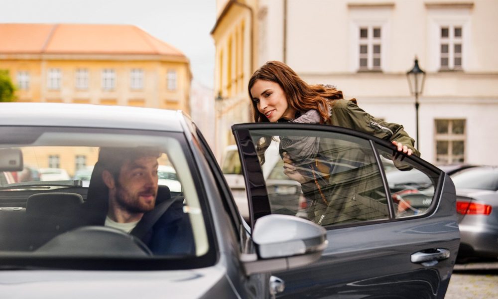 Female passenger gets into Uber