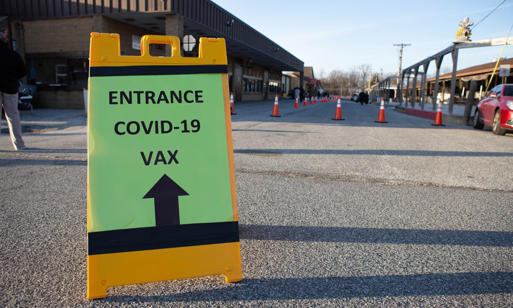 Sign outside a retail location for COVID-19 vaccination