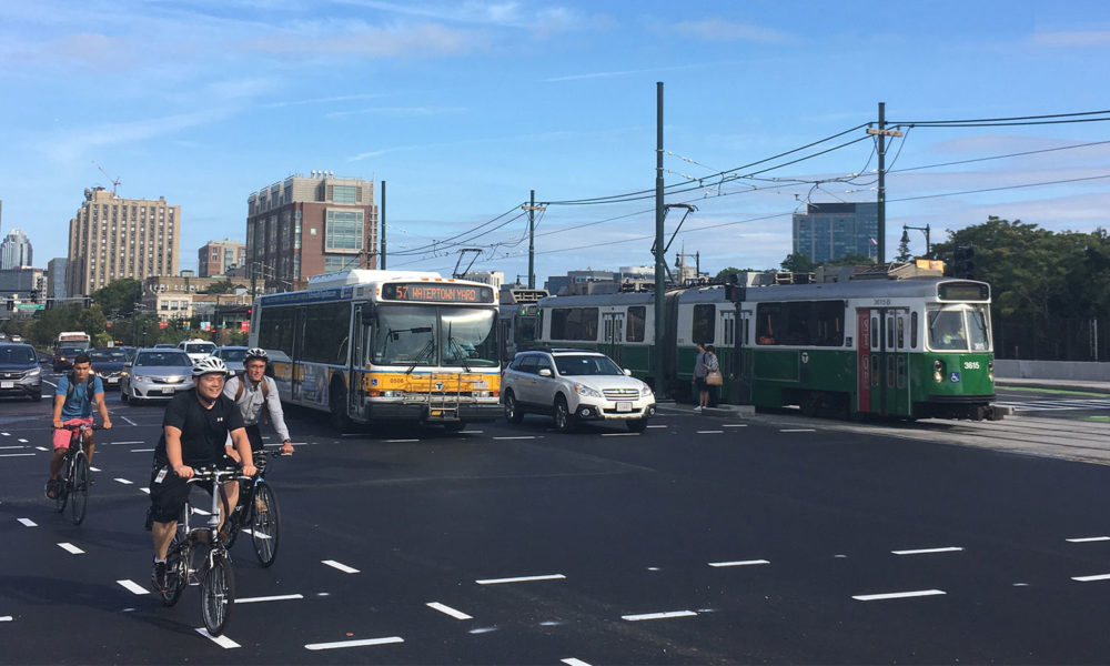 A bike lane, an MBTA bus, and the Green Line trolley in Boston