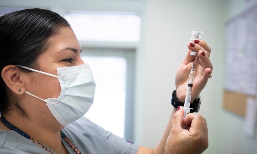 Health care worker readying a vaccination