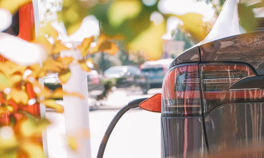 close-up shot of an electric car being charged at a charging station