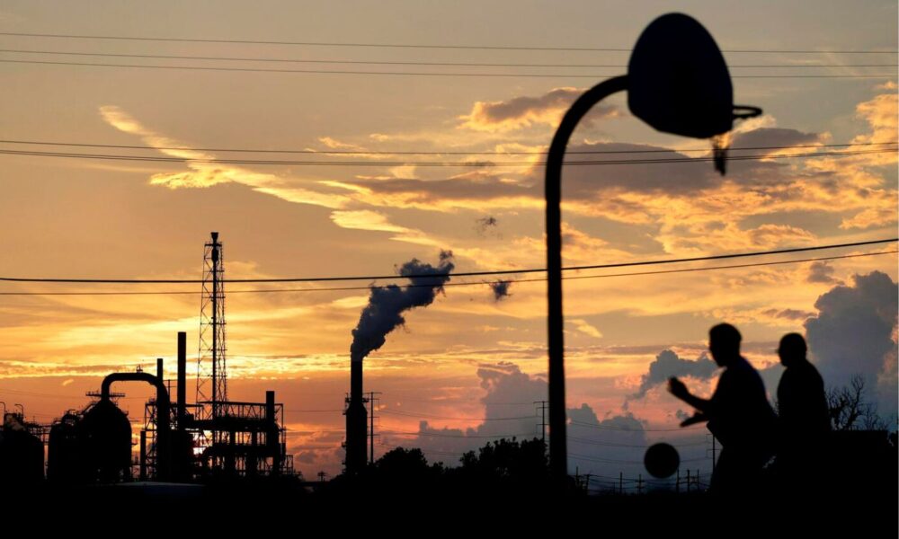 pickup basketball in front of smokestacks