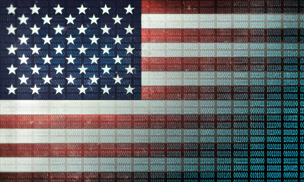 An American flag with binary code superimposed over it.