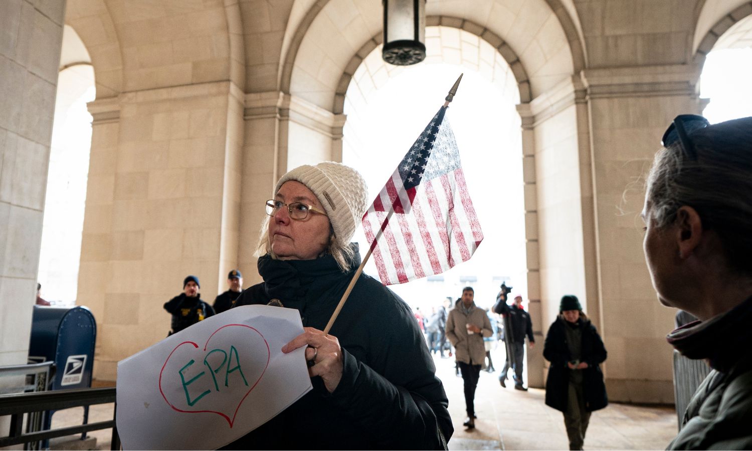 A demonstrator holds a sign that says EPA within a hand-drawn heart, in a federal building in Washington, DC this February.