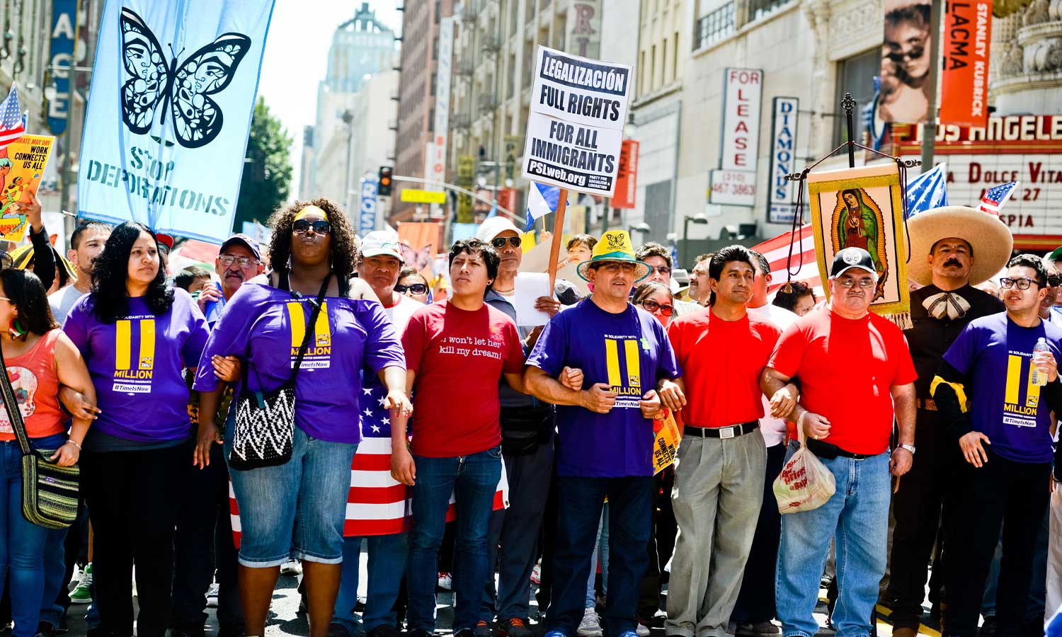 LA May Day protest. People holding banners representing different social structures, organizations.