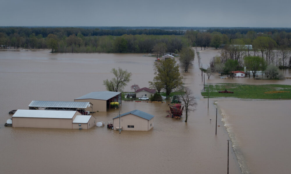 aerial view of flooded farm fields and buildings in Missouri