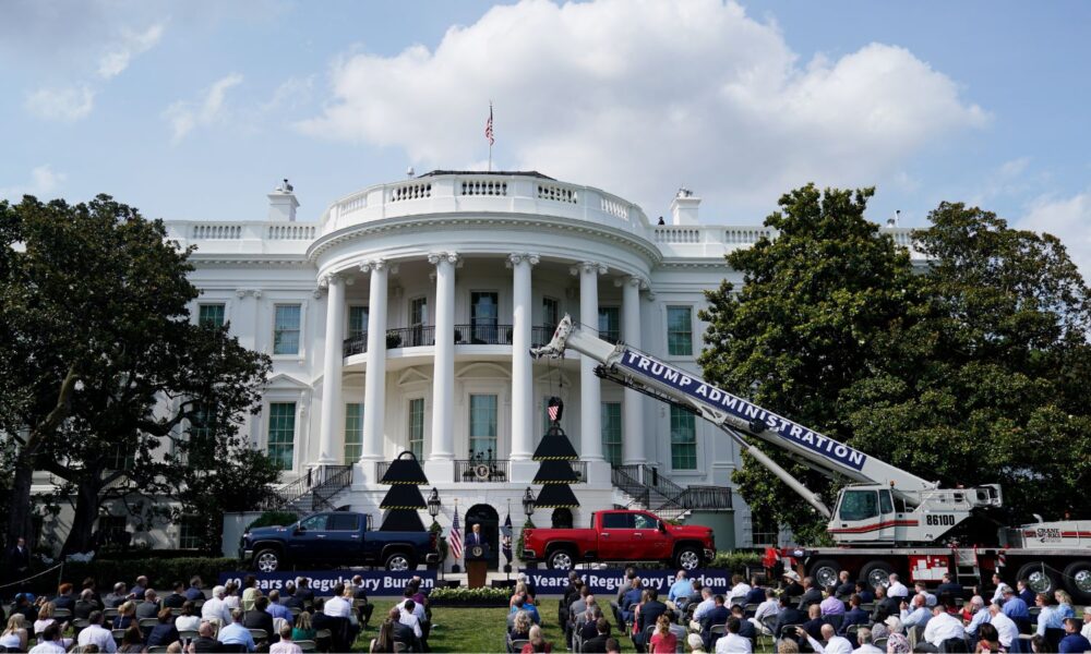 The White House lawn with construction cranes on it representing a rollback of regulations--this event was held in 2020 to celebrate rolling back NEPA, the subject of this post.