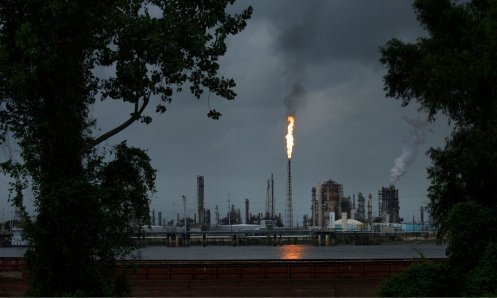 A gas flare from the Shell Chemical LP petroleum refinery illuminates the sky in Norco, Louisiana, part of the state's "cancer alley" where refineries and other petrochemical facilities are concentrated.