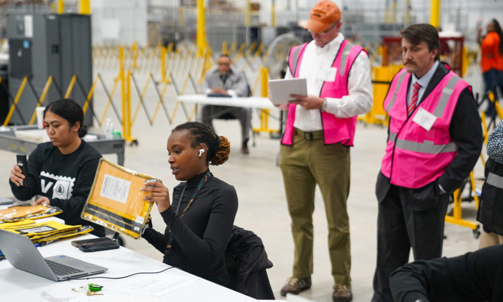 election workers process ballots