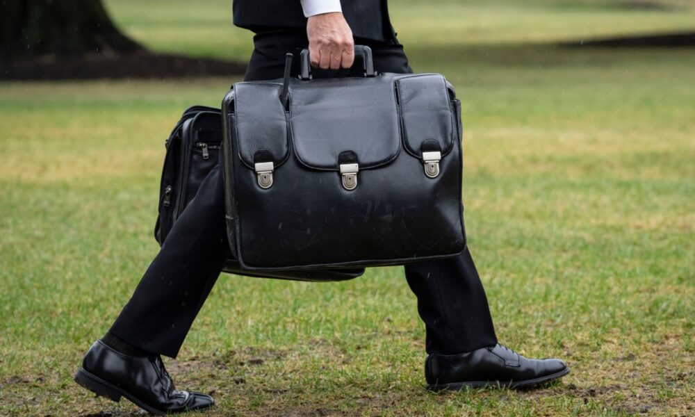 A military aide carries the "nuclear football."